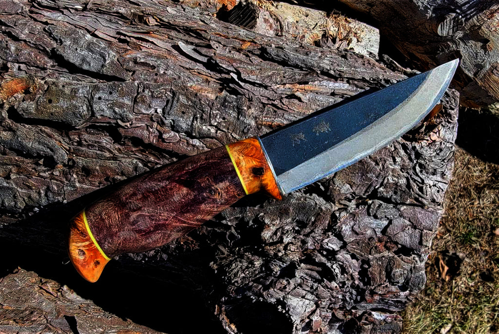 Custom hunting knives with unique shape handles, leather sheath from Harry C, Canada.