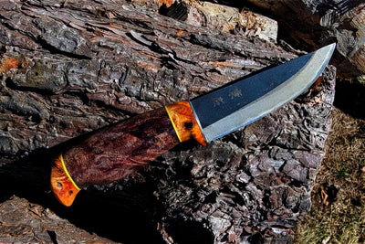 Custom hunting knives with unique shape handles, leather sheath from Harry C, Canada.